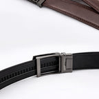 Black belt with a silver buckle on a white background