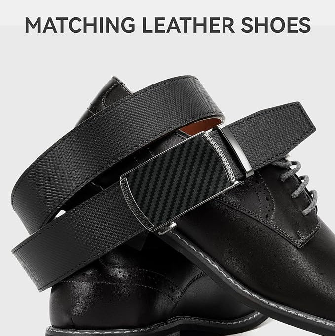Black leather shoes with matching belt on a light gray background