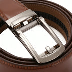 Brown leather belt with a silver buckle on a white background