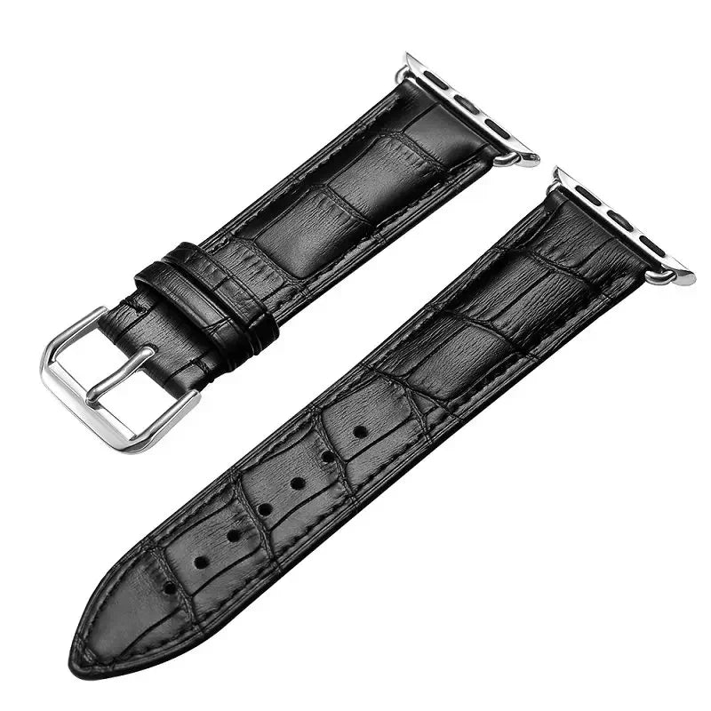 Black leather watch strap with silver buckle on a white background